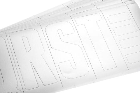 Close-up of white vinyl letters from the Waterproof Vinyl Boating Letter And Number Kit White Finish, 148 Pieces, Coast Guard Compliant