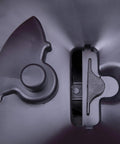 Close-up of oscillating shut off plate on hand operated bag spreader seeder for lawn and garden with high RPM gearbox.