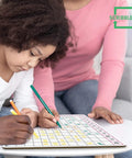 Child using 11 By 14 Dry Erase Multiplication Chart Whiteboard, Double Sided Multiplication Table For Homeschool And Classroom Math Practice.