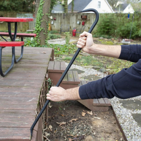 Using a 36 Inch Pry Bar With Drop Forged Steel Build, Rust Resistant Crowbar For Demolition to lift wooden deck planks