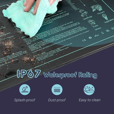 Person wiping Seedling Heating Mat For Seed Starting 10 x 20.75 Inch Pro Grade Waterproof Hydroponic Heating Pad, highlighting IP67 rating.
