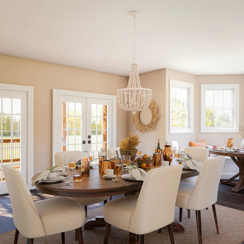 Dumas 3 Light Coastal Boho Chandelier With Weathered White Beads And Exposed Bulbs For A Cozy Vibe over dining area