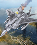F-15 Fighter Jet Metal Model Kit for Adults, DIY 3D Puzzle to Build at Home flying over a detailed coastal scene.