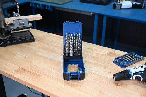 25 Pc HSS Brad Point Drill Bit Set For Woodworking Pro Grade Bits in open case on workbench, heat treated high speed steel.