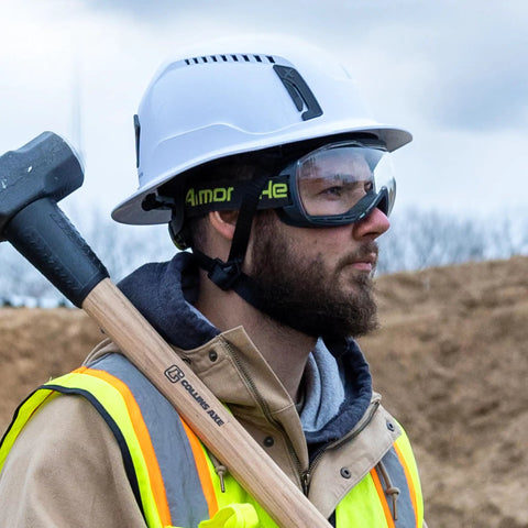 Construction worker wearing MX500 Safety Goggles With 23 Percent Gray Tint, Adjustable Cloth Strap, TruShield Anti Fog Coating