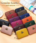 Colorful RFID Blocking Leather Card Holder For Women Tiny Zipper Wallet With Bee Accent on display.