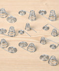 Dope 50 Pack Battery Spring Replacement Set For AA And AAA Coils shown with various nickel plated steel springs on wood surface