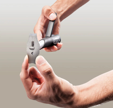 Person inserting blade into the Beast Contour Scraper With Six Changeable Blades For Paint And Rust Removal.