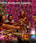 Star Projector Galaxy Night Light With Ocean Wave Led Lamp Remote Control Color Changing Music Speaker Timer For Baby Kids Adults Bedroom Decoration Birthday Party illuminating a holiday dinner scene.