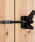 Heavy Duty Self Locking Gate Latch Built Tough For Wood Or Metal Backyard Gates on wooden fence showing installation detail.