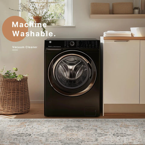 Modern washing machine in a cozy laundry room with plants and shelves above, showcasing a woven basket and wooden flooring.