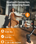 Compact 3 Axis Phone Gimbal With Detachable Magnetic Remote holding smartphone while recording spinning woman in city