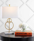26 Inch Gold Leaf And White Marble Modern Circle LED Table Lamp With White Linen Shade on round black table display