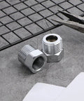 Two chrome-plated pipe fittings with 1/2 in male threads and 3/8 in compression female ends for faucet supply lines.