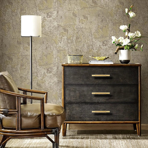 Wooden dresser with three drawers featuring Four Pack 3 Inch Solid Brass Cabinet Pulls In Brushed Gold Finish For Kitchen Cabinets And Drawers Heavy Duty Drawer Handles 3 Inch Center Holes Wardrobe Doors Modern Stylish Durable Construction For Everyday Use And Easy Installation, next to a chair and lamp in a modern room setting.