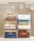 Real Slick Clear Stackable Closet Storage Drawers 4 Pack Medium Capacity 15 Quart Plastic Organizer Bins Featuring Smooth Glide Mechanism with folded clothes.