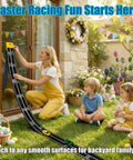 Family using Ultra Long 16.4-Foot Flexible Race Track For Kids 3 And Up, Dual Lane Roll-Up Set With 4 Cars, Suction Cups outdoors