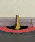 Zeroplay Two Step Plunge Router Bit with Half Inch Shank, Fourteen Inch Length for woodworking, installed in router table.
