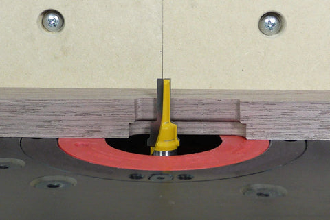 Zeroplay Two Step Plunge Router Bit with Half Inch Shank, Fourteen Inch Length for woodworking, installed in router table.