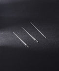 Three Two Piece G23 Titanium Insertion Pin Tapers for Nose Ear Navel Lip Piercings Kit 18G to 14G on black surface