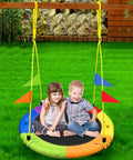 Two children on a Heavy Duty 750Lb Saucer Tree Swing With Adjustable Straps, Multi Strand Ropes, 360 Swivel in a backyard