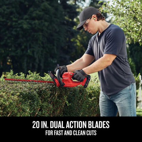 Person using V20 Cordless Hedge Trimmer With Battery And Charger Included 20 Inch Dual Action Blade on bushes in garden
