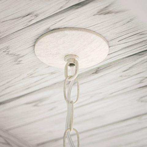 Close-up of ceiling mount for Dumas 3 Light Coastal Boho Chandelier With Weathered White Beads And Exposed Bulbs For A Cozy Vibe