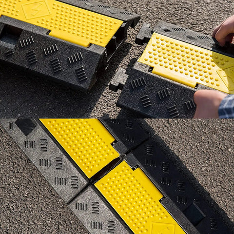 4 Pack 2 Channel Cable Ramp Kit With 11,000 Lbs Axle Capacity showing black and yellow sections on driveway
