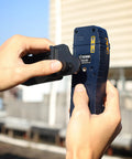 Hands adjusting Line Laser Level Detector With Pulse Receiver For Accurate Alignment, Green And Red Pulse Readouts, Up To 165 Feet Range