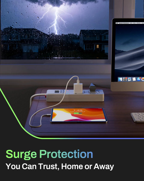 Eight Outlet Surge Protector With Seven Day Digital Timer on desk in front of lightning storm, powering laptop and tablet.
