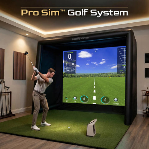 Man using Inflatable Golf Simulator Enclosure 12 X 9 Ft for Indoor Outdoor Use, Portable Hitting Cage with Impact Screen indoors.