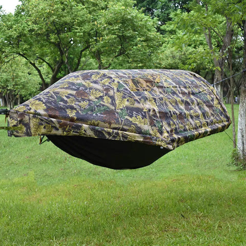 All In One Camping Hammock Tent With Mosquito Net And Rain Fly 3 In 1 Outdoor Hammock set up in a leafy backyard