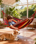 Canvas Hammock With Durable Comfort For Patio Yard Garden Backyard And Travel Portable And Easy Setup With Carrying Bag Included Ideal For Camping Outdoor Relaxation In Spacious 230 Centimeter Long Design For Supremely Comfortable Kick Back Anywhere shown with a child lounging indoors.