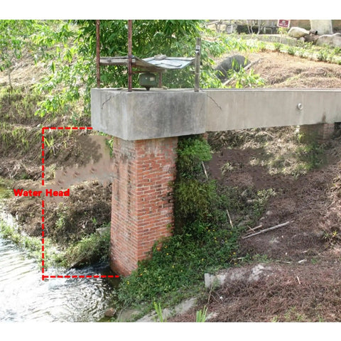 1kW To 1.5kW Hydraulic Generator installation showing water head and flow for home use, with brick support structure.