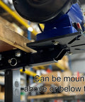 Tough As Nails Universal Vise And Bench Grinder Mount attached under a workbench with a bench grinder, showcasing heavy-duty steel build.
