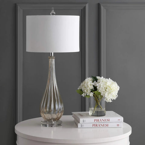 Champagne Glass Table Lamp With Teardrop Crystal Accent, 32.75 Inch Tall, White Faux Silk Drum Shade on round bedside table