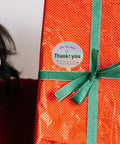 Thank You Stickers For Packaging And Gift Wrapping on red gift box with green ribbon, Copper Plate Self Adhesive Sealing Labels visible