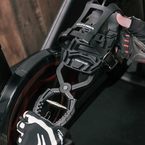 Using the toe clip cages with removal tool set for Shimano SPD SL pedals on spin bike, enhancing sneaker riding and adjustment ease.