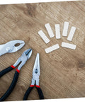 Hella Sturdy Slick Furniture Connector Kit 100 Piece Hidden Fasteners on wood surface with pliers and joiners.