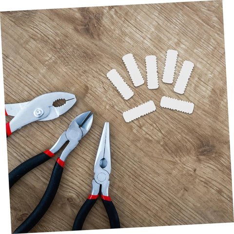 Hella Sturdy Slick Furniture Connector Kit 100 Piece Hidden Fasteners on wood surface with pliers and joiners.
