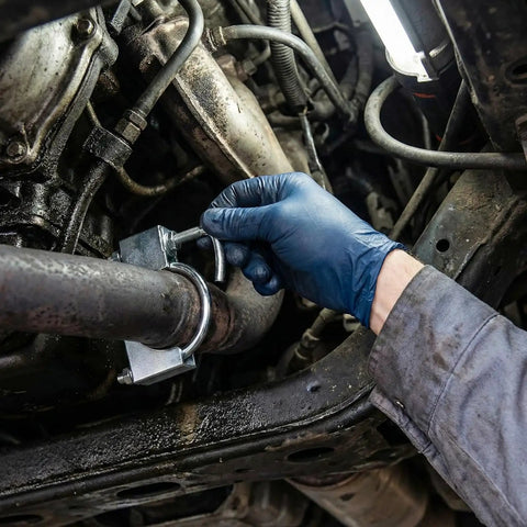 Mechanic installing Two Pack Exhaust Clamp With Hanger For 3 Inch Exhaust Pipe Heavy Duty Universal Exhaust Hanger Kit For Cars And Trucks