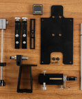 Components of Premium Precision Knife Sharpening System With Adjustable Angle Guide Pro Grade Sharpening Kit on wood table