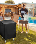 Outdoor Prep Table Cover 24x24x34 Inches beside a BBQ grill in a patio setting, showcasing weatherproof Oxford fabric protection.