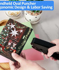 Using Oval Hole Punch For Papers And ID Cards Heavy Duty Handheld Slot Punch on a holiday card, showing ergonomic grip