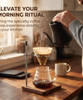 Pouring water into coffee dripper with Solid Black Walnut Pour Over Coffee Maker Stand and adjustable holder.