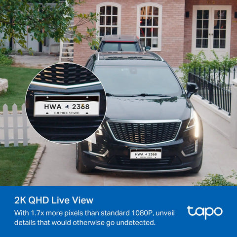 Badass 2K Plus Outdoor Wireless Security Camera With Modular Solar Panel And Rechargeable Battery For All Weathers And No Fuss Wire Free Install Featuring Rock Solid Hd Motion Detection And Night Vision capturing vehicle with license plate in driveway.