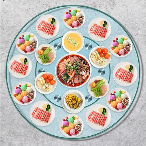 Clear Round Glass Lazy Susan Turntable For Dining Table With 360 Degree Swivel Easy Spin Smooth Quiet Rotation Serving Tray Stand 120cm 47 Inch Diameter Great For Kitchen Counter Dining Room Family Dinners And Party Tables with assorted dishes and desserts displayed.