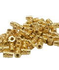 Heavy Duty Brass Heat Set Inserts For 3D Printing And Plastic Components 10-24 Threaded Nuts, showing a pile of metal inserts.