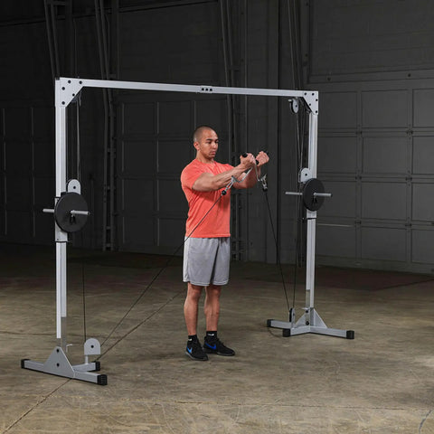 Man using Beefy Heavy Duty Cable Crossover Machine For Home Gym Functional Trainer with dual pulleys in gym setting.
