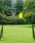 Premium Half Inch AR500 Steel Shooting Target For Outdoors with Gong Silhouette hanging on metal stand in grassy field